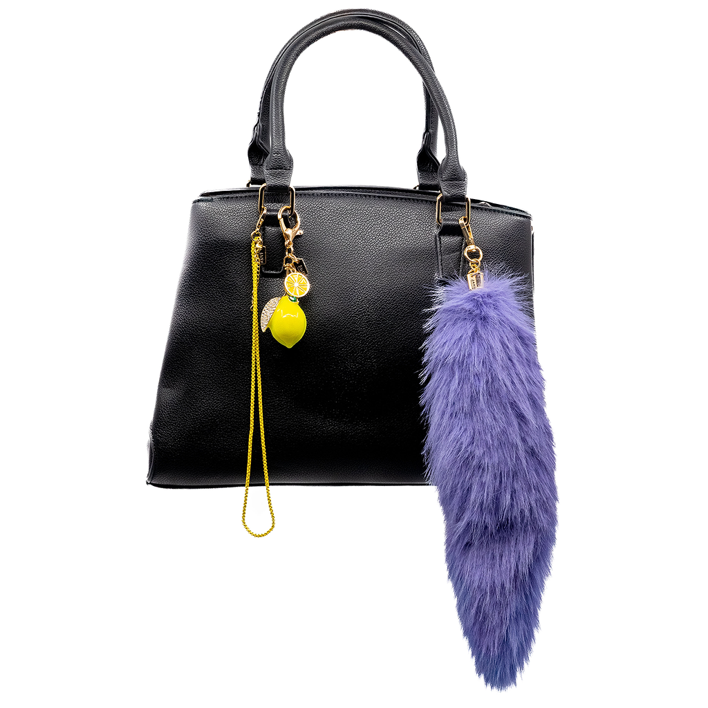 Elevate your outfit with this vibrant yellow box chain. Its bold colour and sleek design add a modern flair to your bag. Wrap or hang it or use it to hang other charms from it. It's the perfect way to achieve the messy bag charm look.