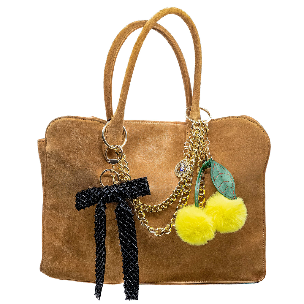 Bring a playful pop of colour to your ensemble with this plush yellow cherry pom charm. Its soft texture and vibrant hue add a whimsical touch, making it a delightful addition to your bag. A sweet way to express your fun-loving personality.