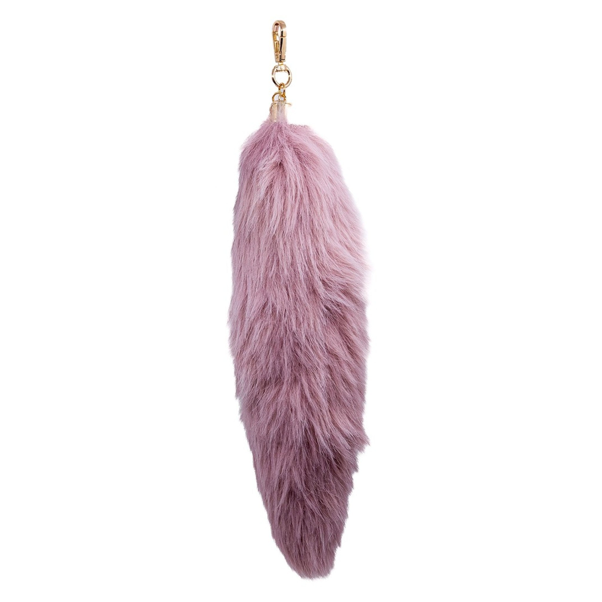 Embrace authenticity with this luxurious light pink faux-fur pendant charm. Its soft texture and elegant hue add a touch of sophistication to your accessories. Perfect for layering or as a standalone statement piece on your bag.