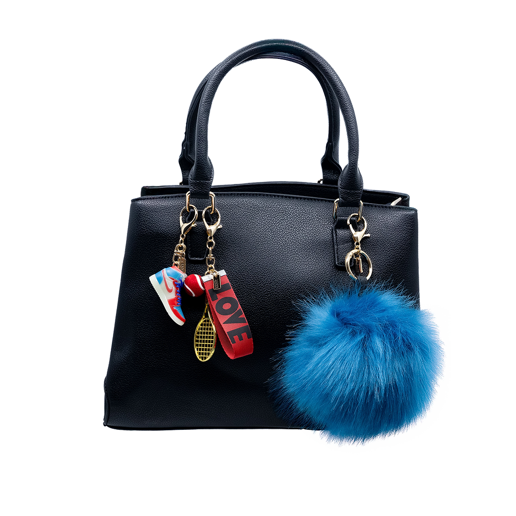 Add a playful pop of colour with this large blue faux-fur pom pom charm. Its soft texture and vibrant hue bring a bold statement to your accessories, making it a perfect addition for those who love to make a statement.