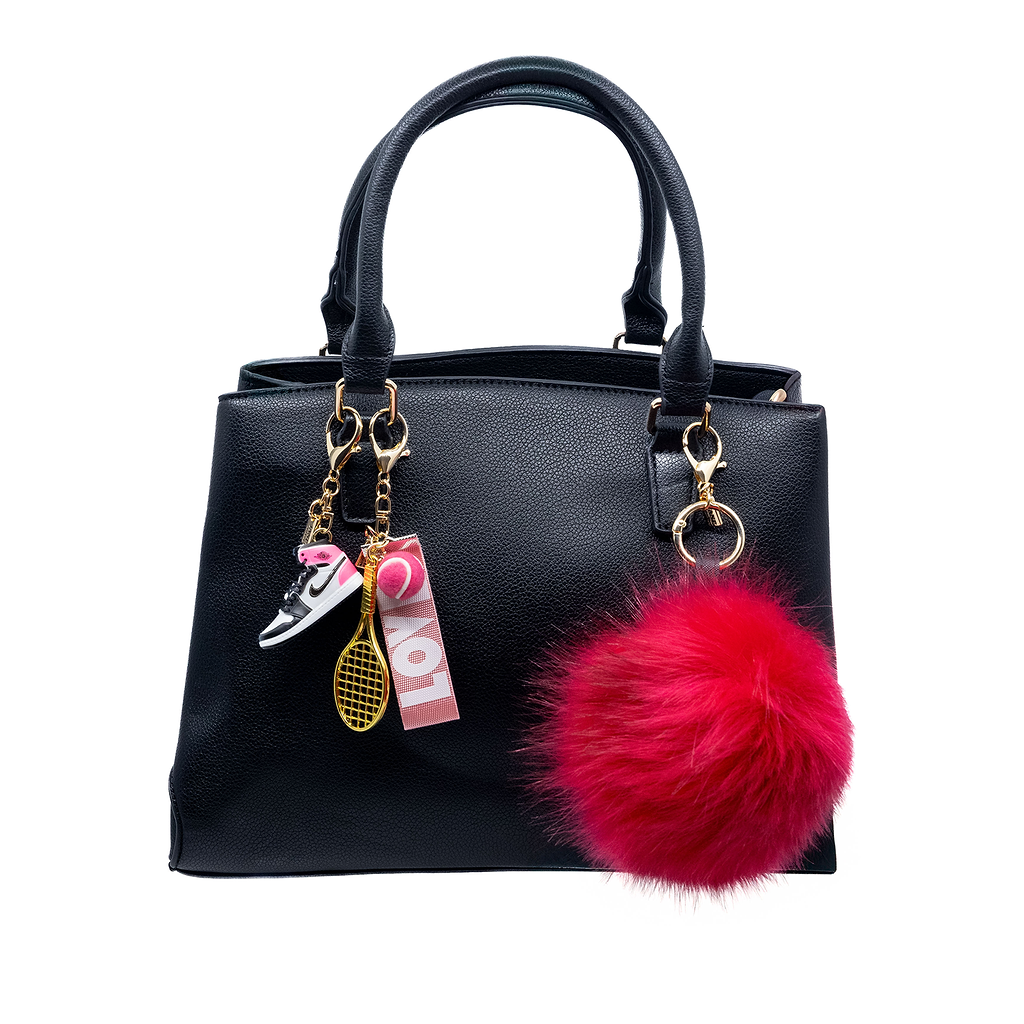 Add a bold statement to your ensemble with this large watermelon faux-fur pom pom charm. Its plush texture and vibrant hue bring a playful yet sophisticated element to your bag.