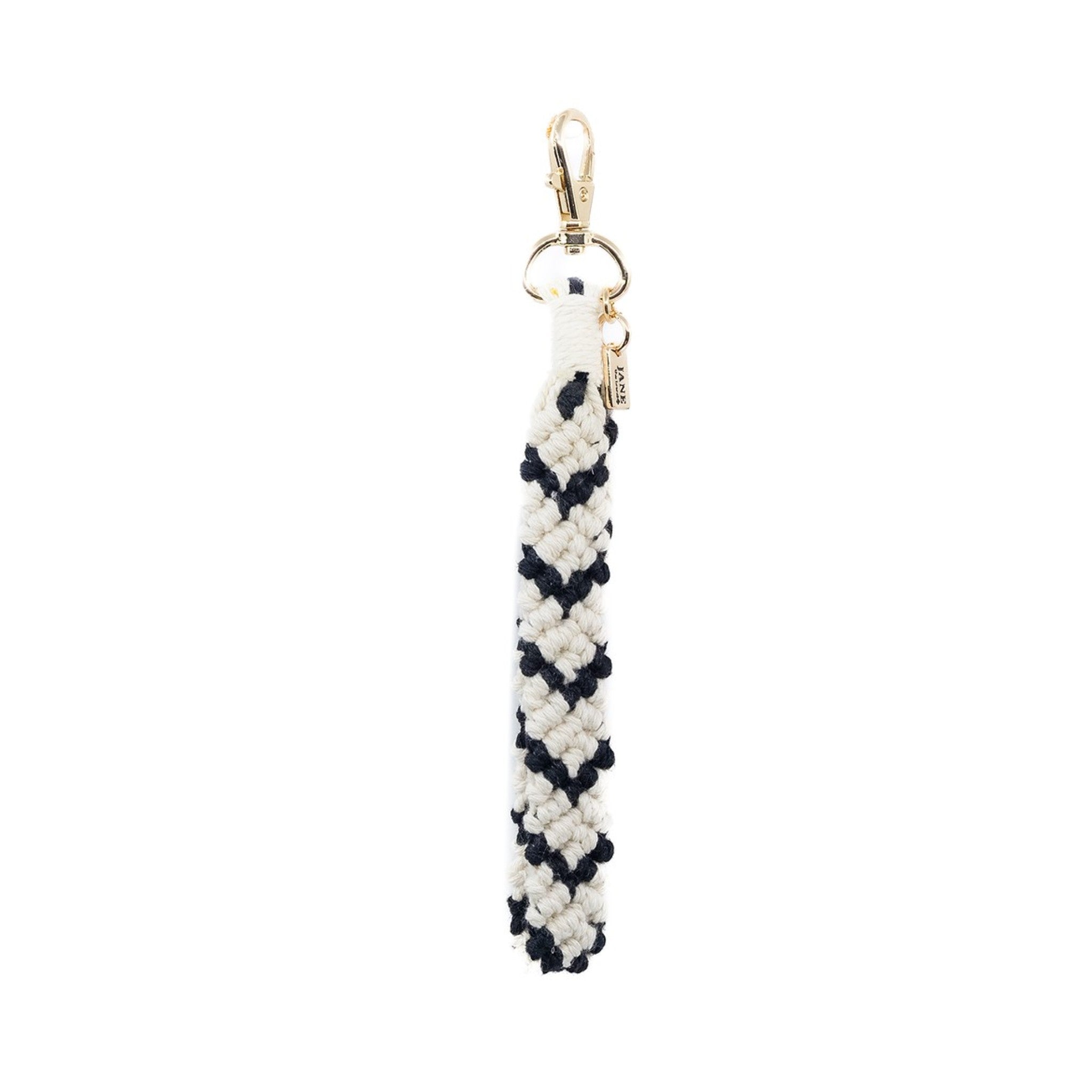 This handcrafted red and white macrame charm brings a touch of boho elegance to your accessories. The contrasting colours and intricate knotting add a bold yet refined texture, perfect for adding a unique flair to your bag.
Macrame Charm Black/White