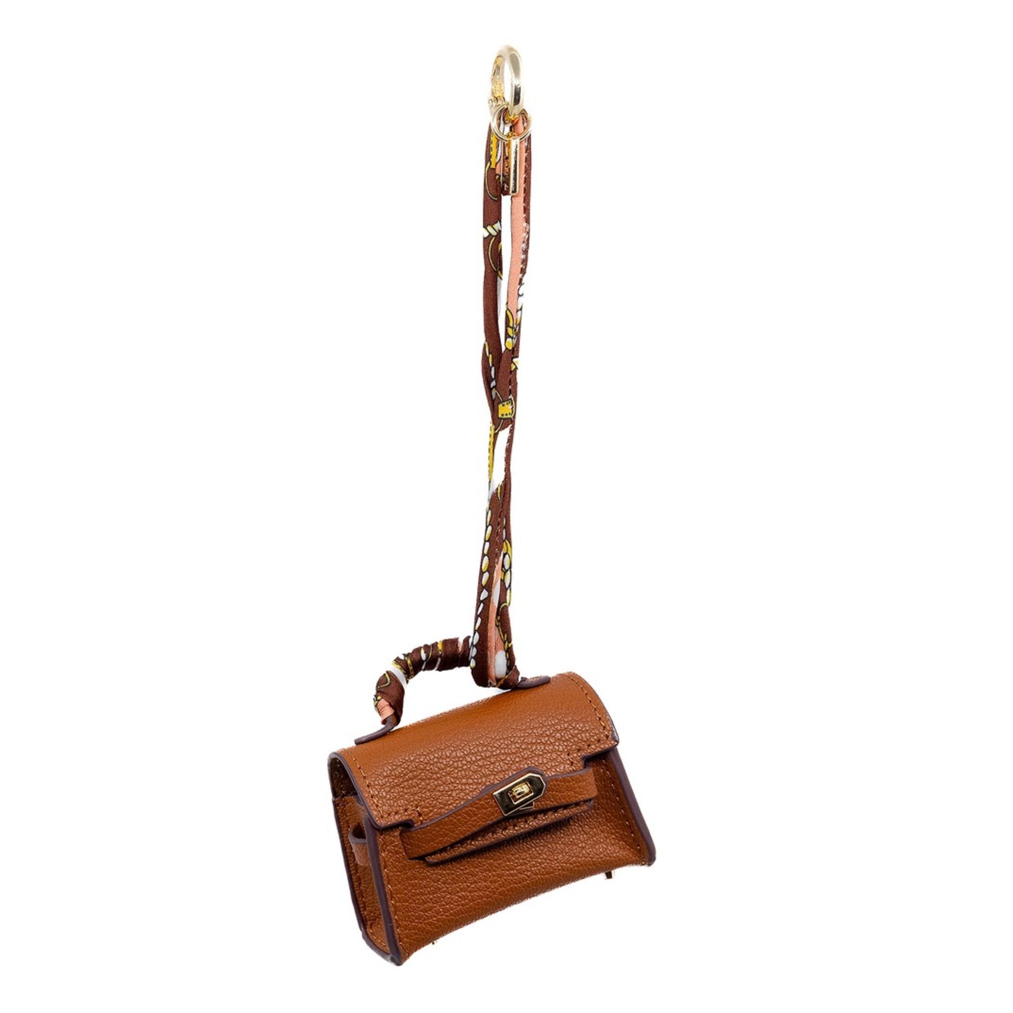 This mini brown Birkin-inspired bag charm exudes timeless sophistication. Its classic design and rich hue make it a versatile addition to any accessory collection. Not just a charm, it doubles as a stylish AirPod holder, combining fashion with functionality.