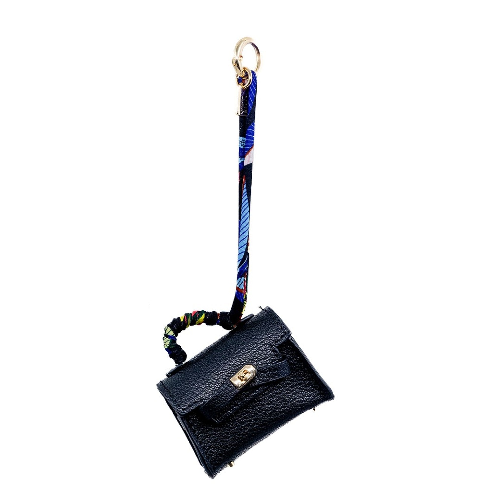 This mini black Birkin-inspired bag charm offers a sleek and sophisticated touch to your ensemble. Its timeless design and versatile colour make it a must-have accessory. It can also serve as a chic AirPod holder, merging style with practicality.