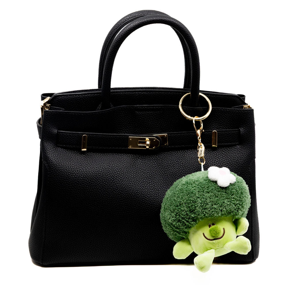 Turn heads with this quirky and cuddly Broccoli Buddy! With a soft, fluffy texture, a sweet embroidered smile, and a delicate flower accent, this charm adds a playful twist to your bag. Perfect for anyone who loves their greens with a side of charm.