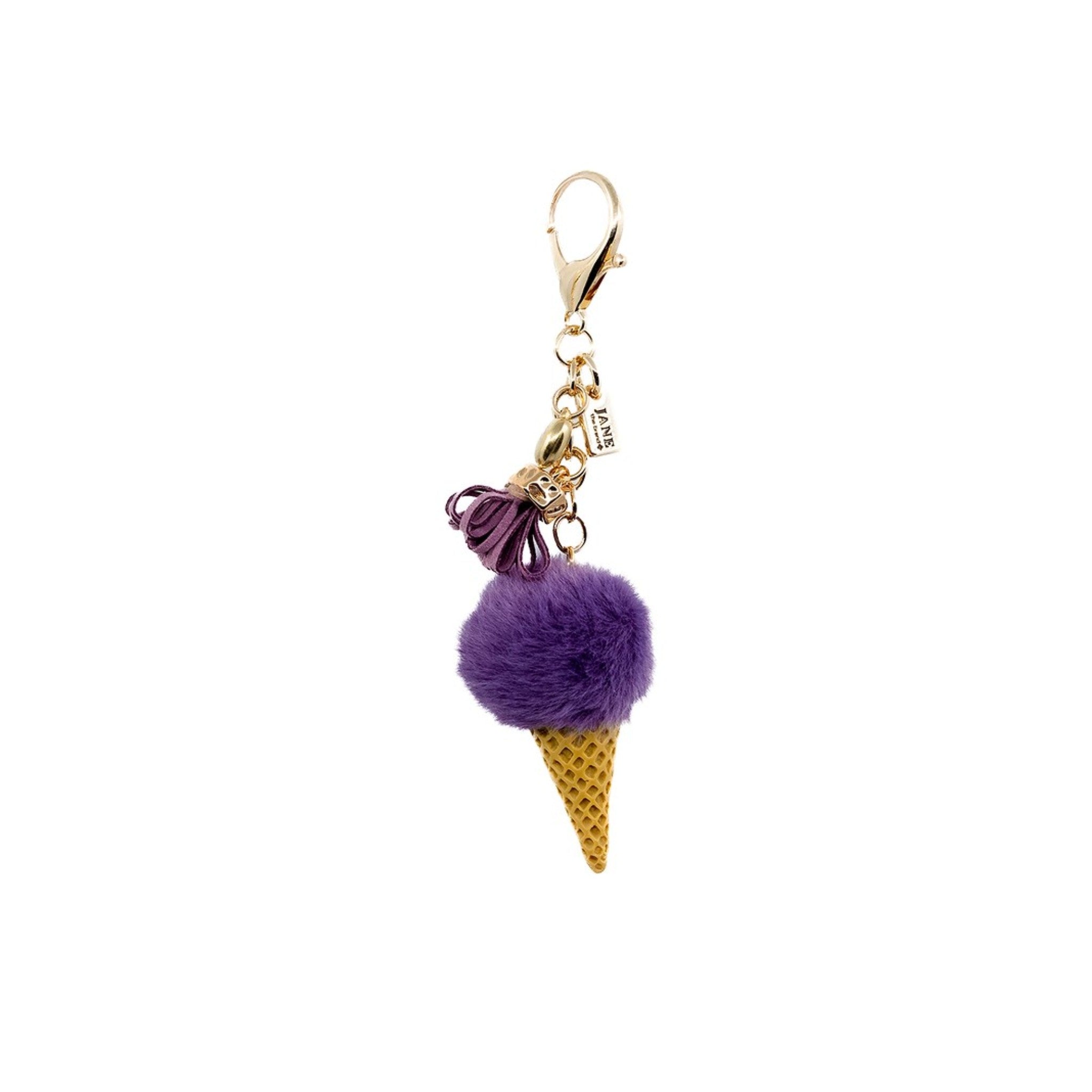 Add a touch of whimsy to your accessories with this purple plush ice cream charm. Its soft, velvety texture and vibrant hue bring a playful and sweet element to your bag. Perfect for those who appreciate a blend of elegance and fun, this charm is an ideal addition to your bag.