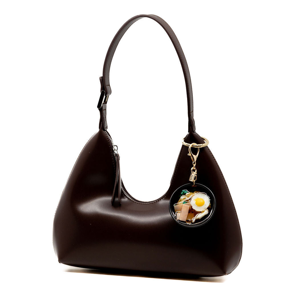 A food lover’s fantasy in charm form. Featuring sunny-side-up egg and ham, glossy broth, this one’s for the savoury snack lovers. Charm up your bag with this amazing new bowl.