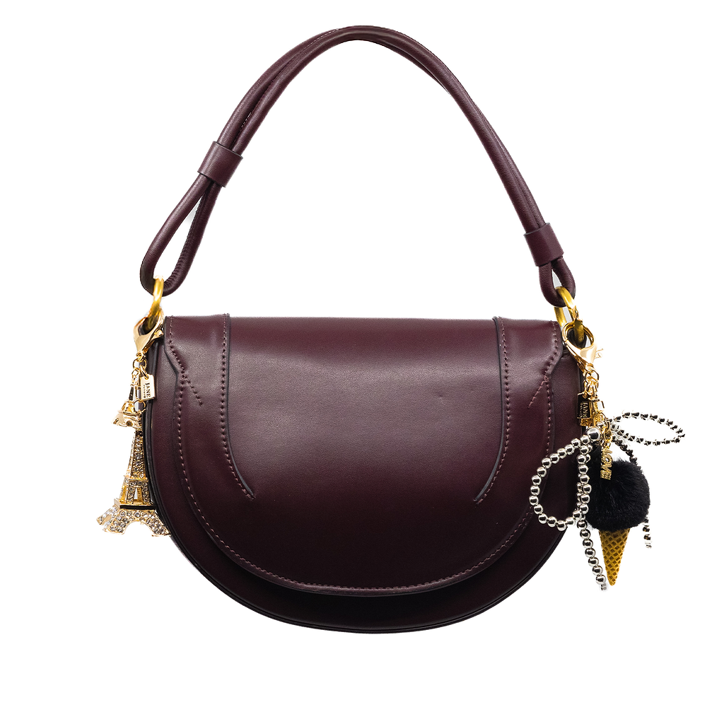 Elevate your accessories with this silver pearl bow charm, adorned with Embrace the allure of Paris with this intricately designed Eiffel Tower charm. Its detailed craftsmanship and iconic silhouette make it a timeless addition to your bag, perfect for adding a touch of romance and wanderlust to your purse.