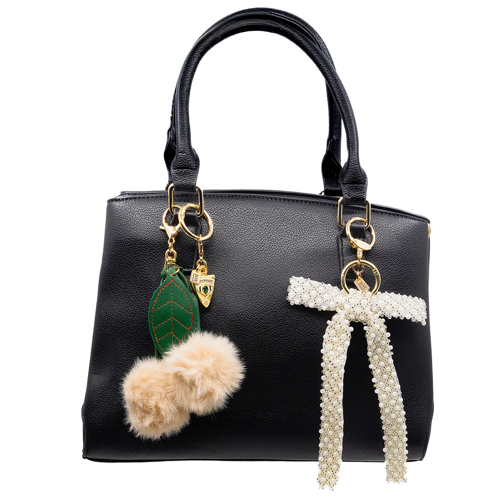 Embrace timeless elegance with this cream pearl beaded bow charm. Its intricate beadwork and soft hue add a touch of sophistication to your accessories. Perfect for elevating your bag and your outfit.