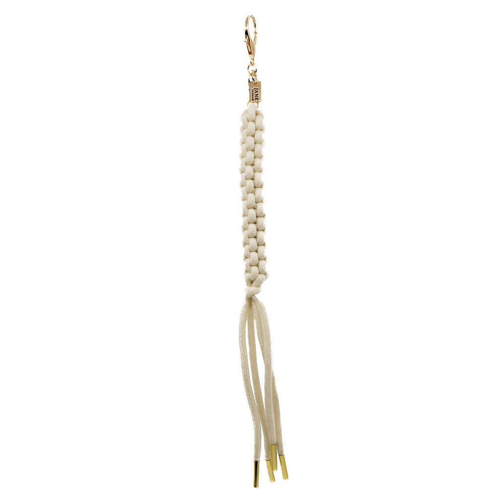 Our classic white braided tassel now with a gold clasp for easy attachment. Elegant, effortless, and perfect for layering with other charms for that “charm-core” aesthetic.