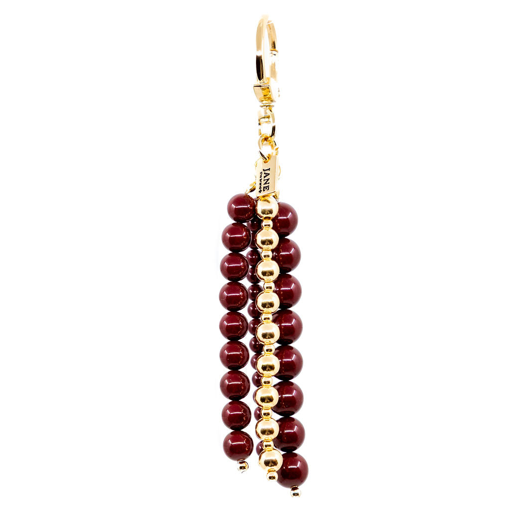 Gold and burgundy beaded charm