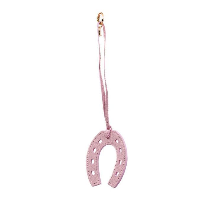Embrace authenticity with this luxurious light pink faux-fur pendant charm. Its soft texture and elegant hue add a touch of sophistication to your accessories. Perfect for layering or as a standalone statement piece on your bag.