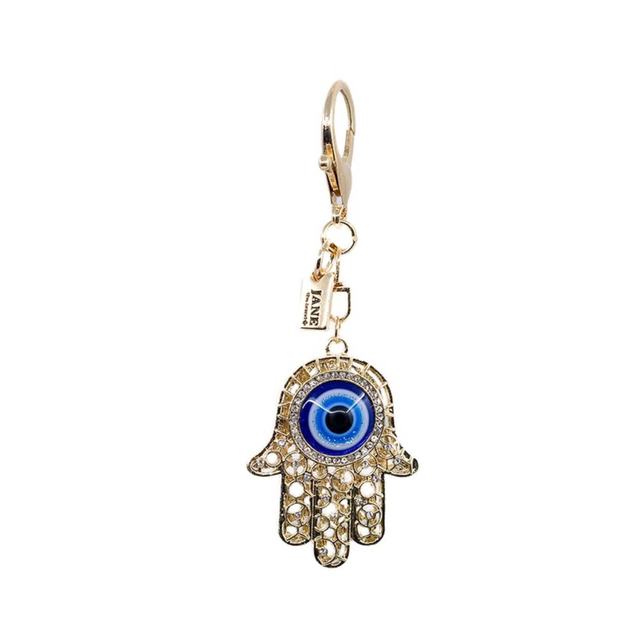 Embrace protection and positivity with this gold metal evil eye (Hamsa) charm. The intricate design and shimmering finish bring a meaningful touch to your accessories, symbolizing good fortune and spiritual well-being.