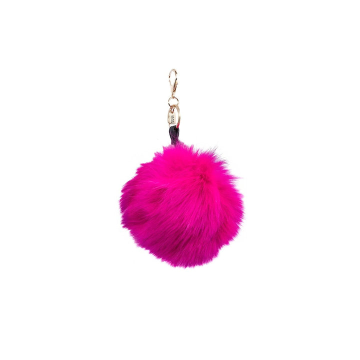 Brighten your ensemble with this large fuchsia faux-fur pom pom. Its playful colour and soft texture add a whimsical touch, reflecting a free-spirited personality.
