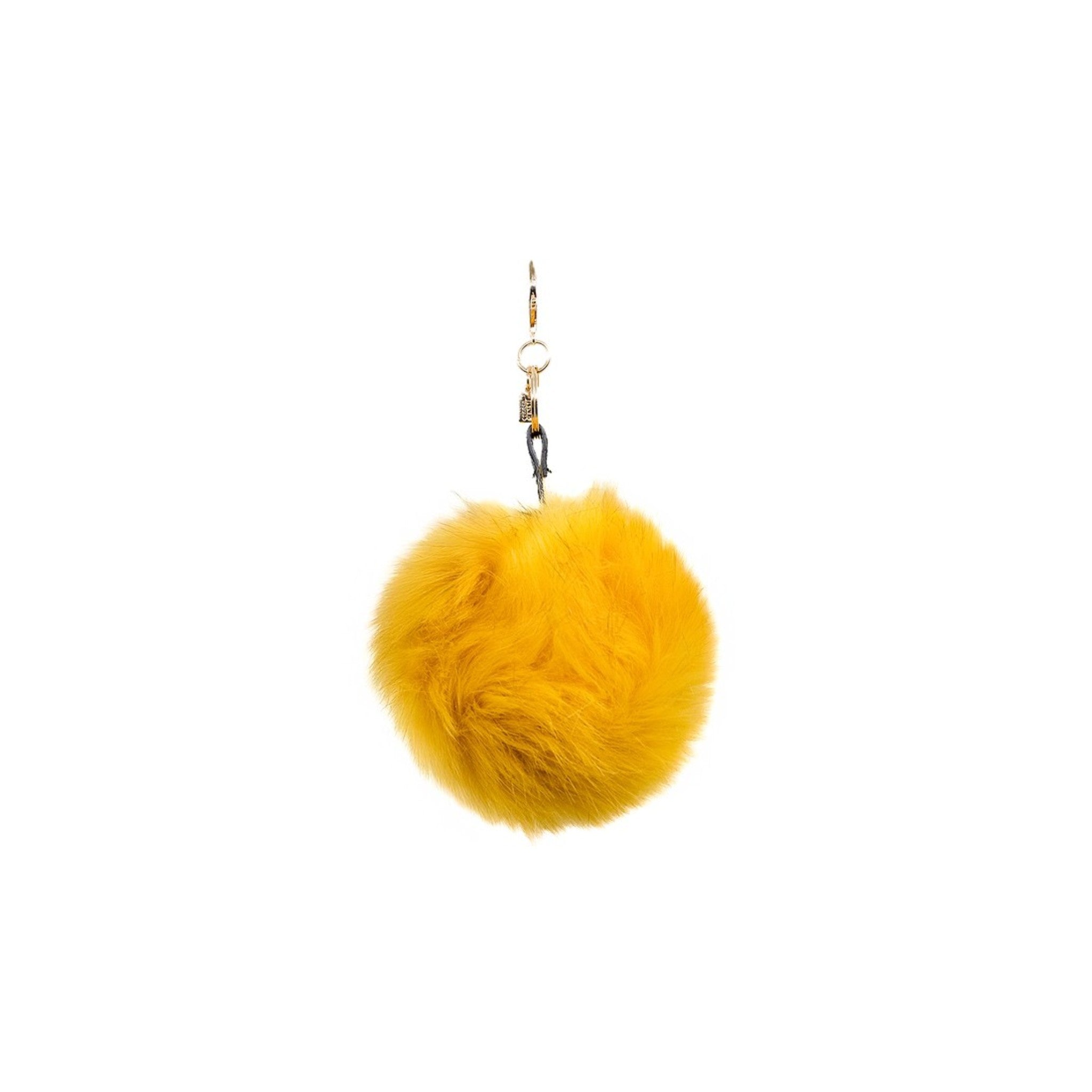 Add a touch of luxury and fun with this golden yellow extra-large faux-fur pom pom charm. Its plush texture and vibrant hues bring a bold statement to your accessories, making it a perfect addition for those who love to make a statement.