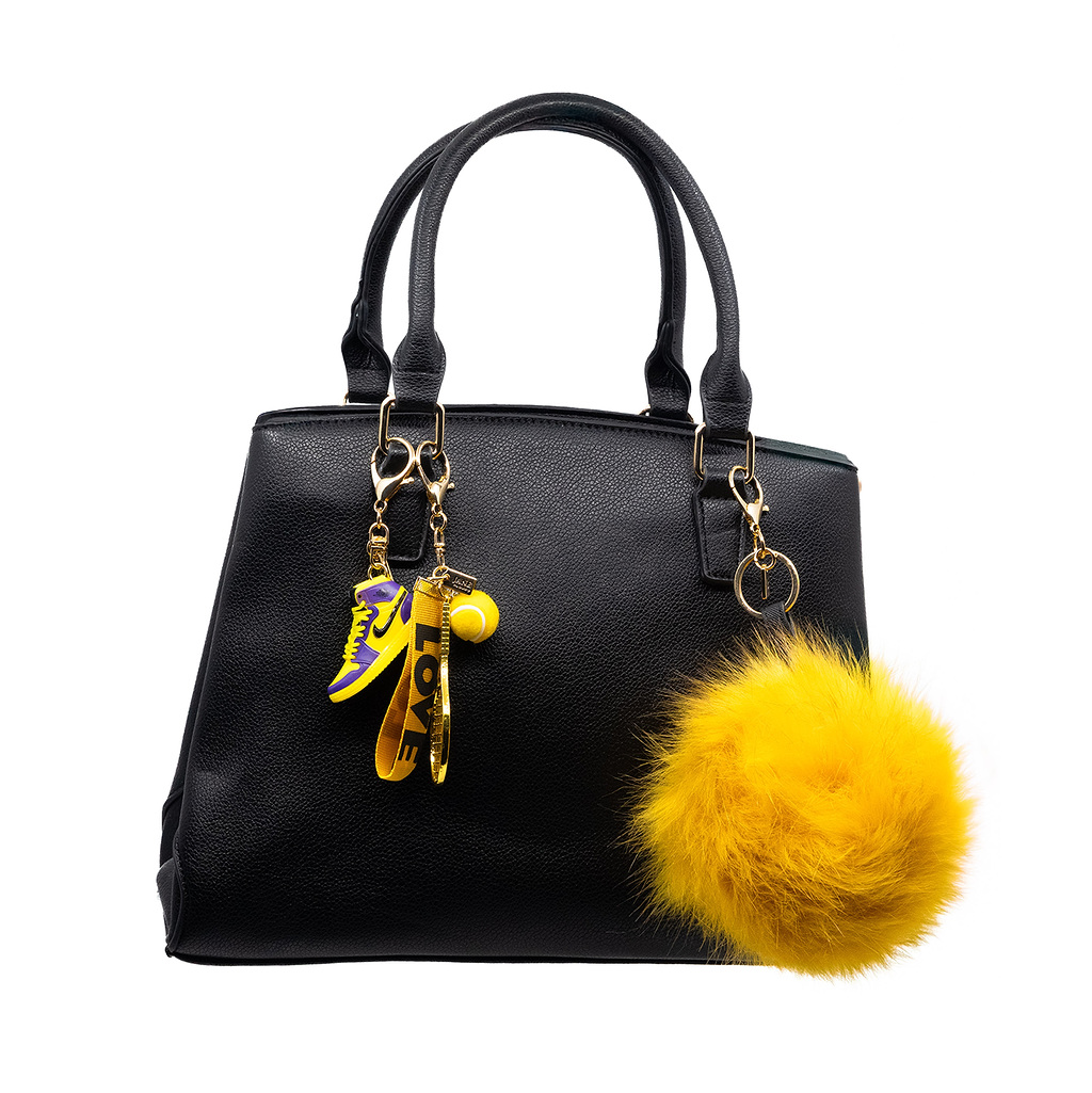 Add a touch of luxury and fun with this golden yellow extra-large faux-fur pom pom charm. Its plush texture and vibrant hues bring a bold statement to your accessories, making it a perfect addition for those who love to make a statement.
