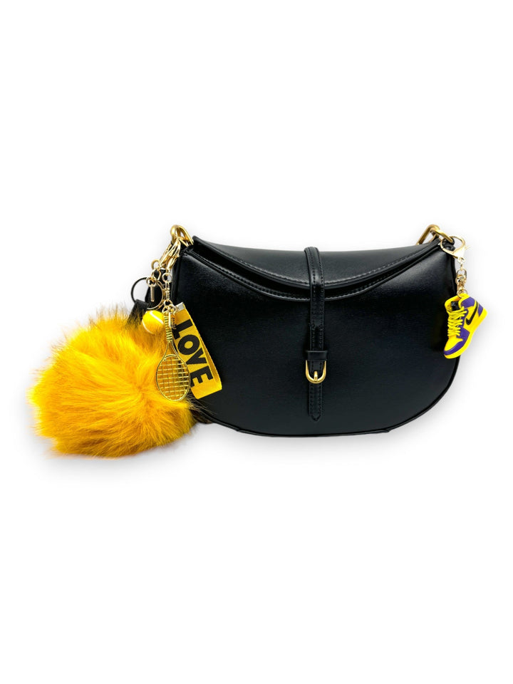 Add a touch of luxury and fun with this golden yellow extra-large faux-fur pom pom charm. Its plush texture and vibrant hues bring a bold statement to your accessories, making it a perfect addition for those who love to make a statement.