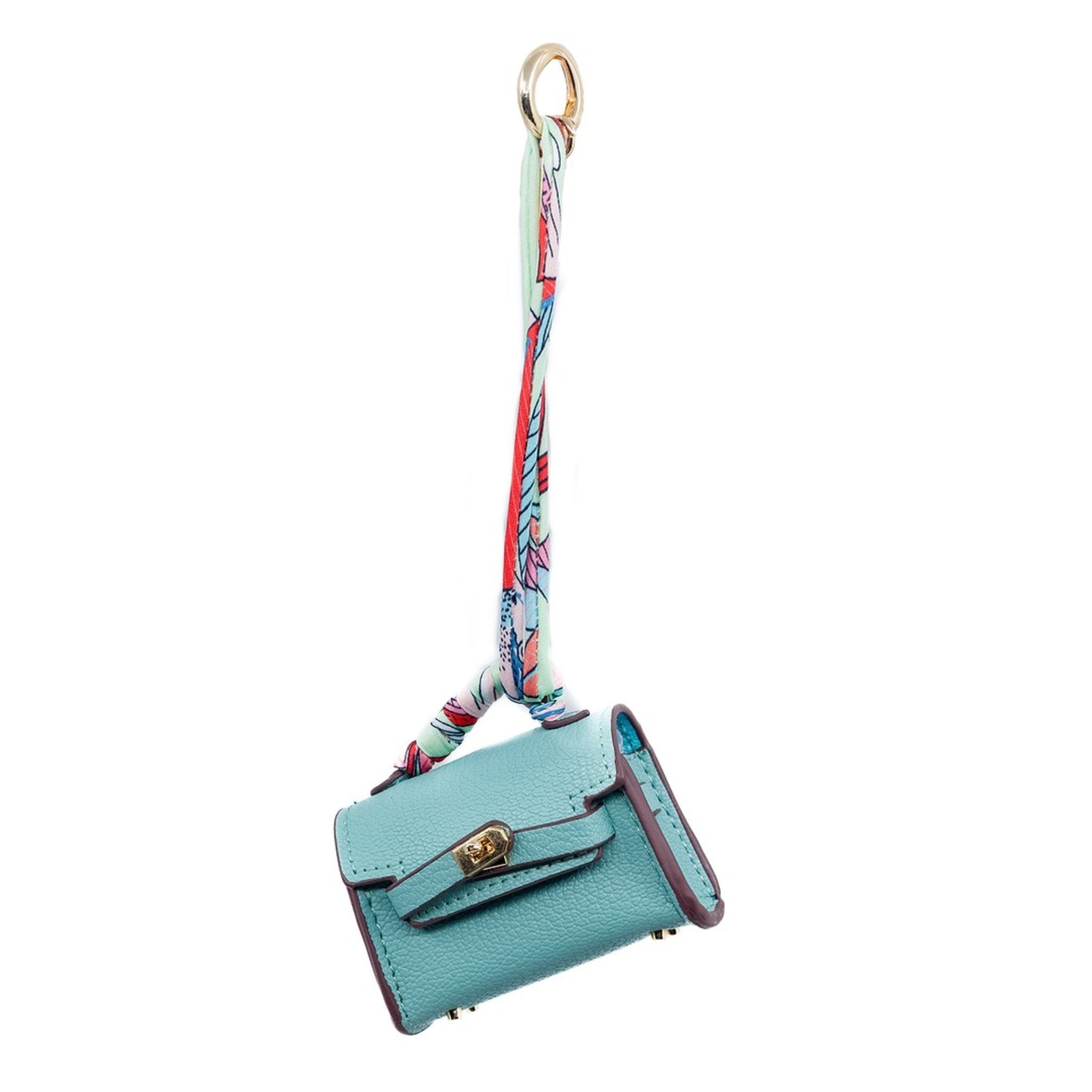 This mini blue Birkin-inspired bag charm adds a refreshing pop of color to your purse. Its vibrant hue and sleek design make it a standout accessory. It can also double as a stylish AirPod holder, combining fashion with functionality.