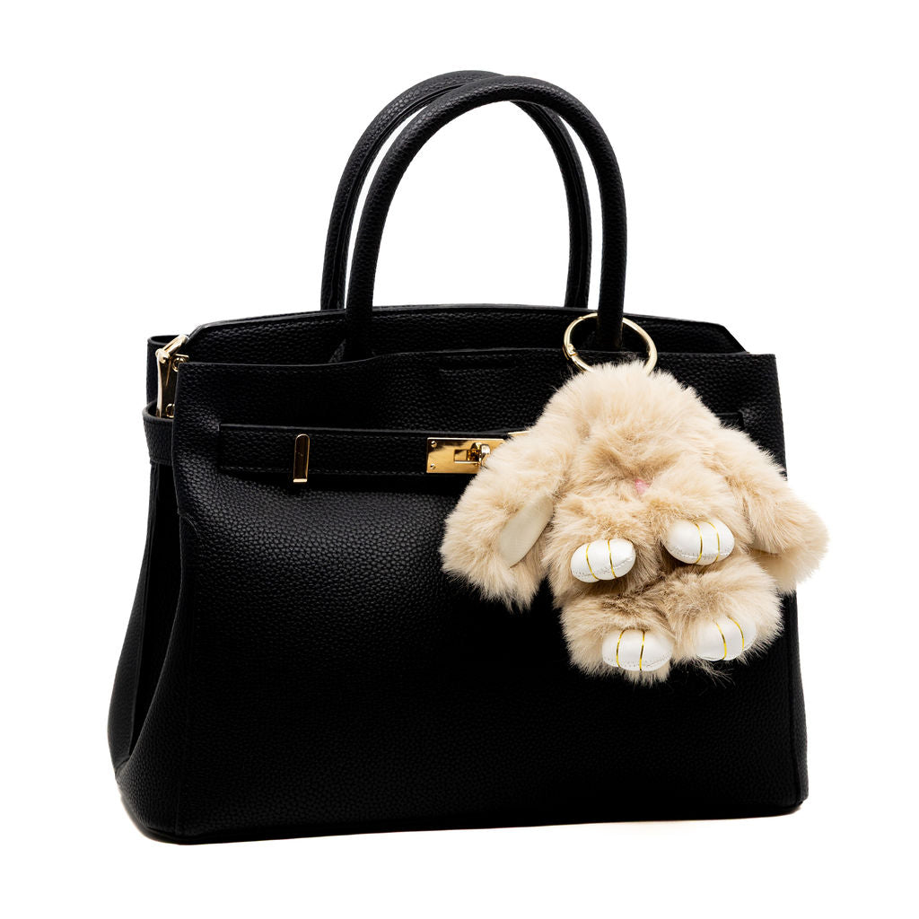 Meet your newest fuzzy friend. This mocha coloured bunny is soft, sweet, and neutral-toned—perfect to pair with any bag or keychain for a cozy-chic vibe.