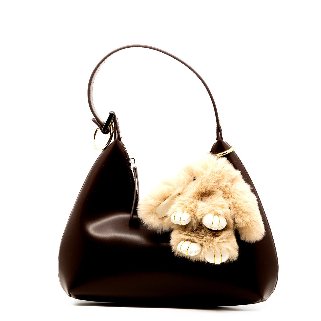 Meet your newest fuzzy friend. This mocha coloured bunny is soft, sweet, and neutral-toned—perfect to pair with any bag or keychain for a cozy-chic vibe.