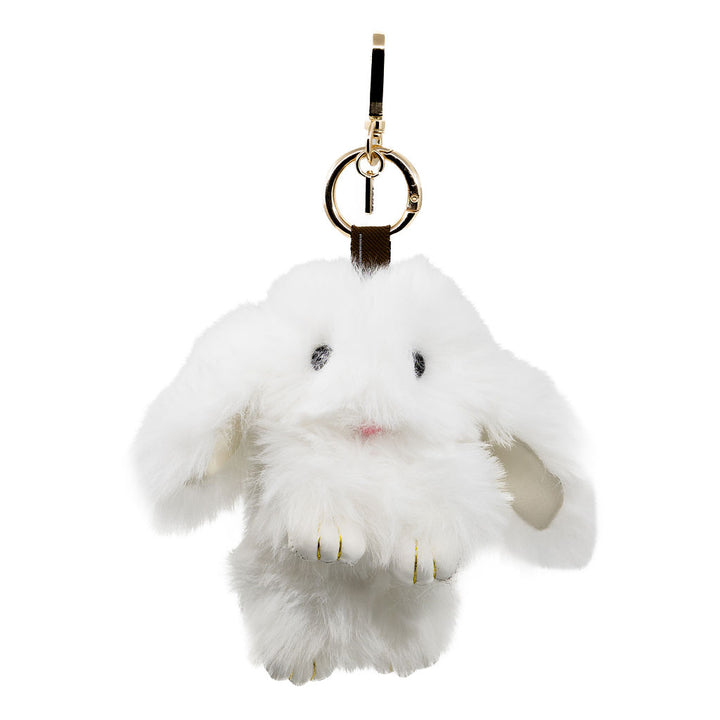 Snuggle up to our softest charm yet. This fluffy white bunny brings a cozy, luxe feel with its ultra-soft fur and floppy ears—perfect for where ever your day brings you.