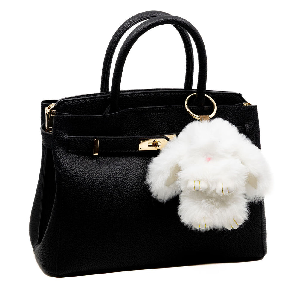 Snuggle up to our softest charm yet. This fluffy white bunny brings a cozy, luxe feel with its ultra-soft fur and floppy ears—perfect for where ever your day brings you.