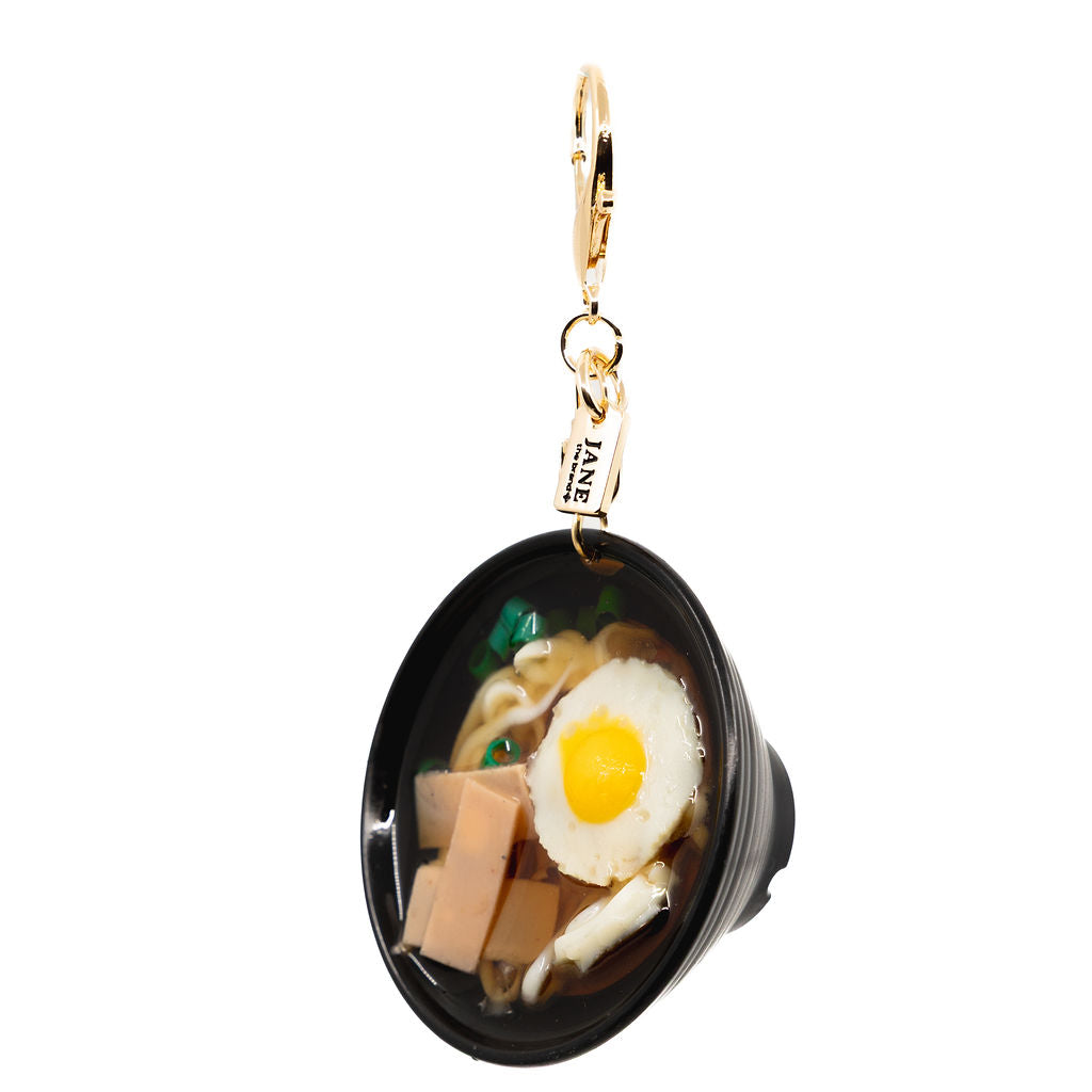 A food lover’s fantasy in charm form. Featuring sunny-side-up egg and ham, glossy broth, this one’s for the savoury snack lovers.&nbsp; Charm up your bag with this amazing new bowl.