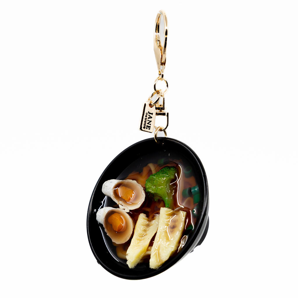 Slurp-worthy style in miniature form. The ramen charm features rich detail with lifelike ramen noodles and veggies. It’s the perfect charm for foodies, ramen lovers, and anyone craving a little flavour in their bag game.