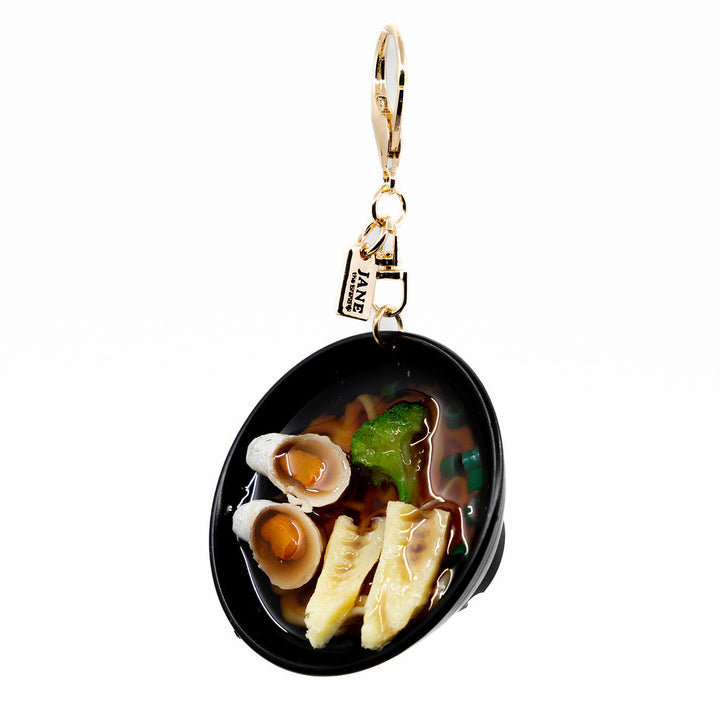 Slurp-worthy style in miniature form. The ramen charm features rich detail with lifelike ramen noodles and veggies. It’s the perfect charm for foodies, ramen lovers, and anyone craving a little flavour in their bag game.
