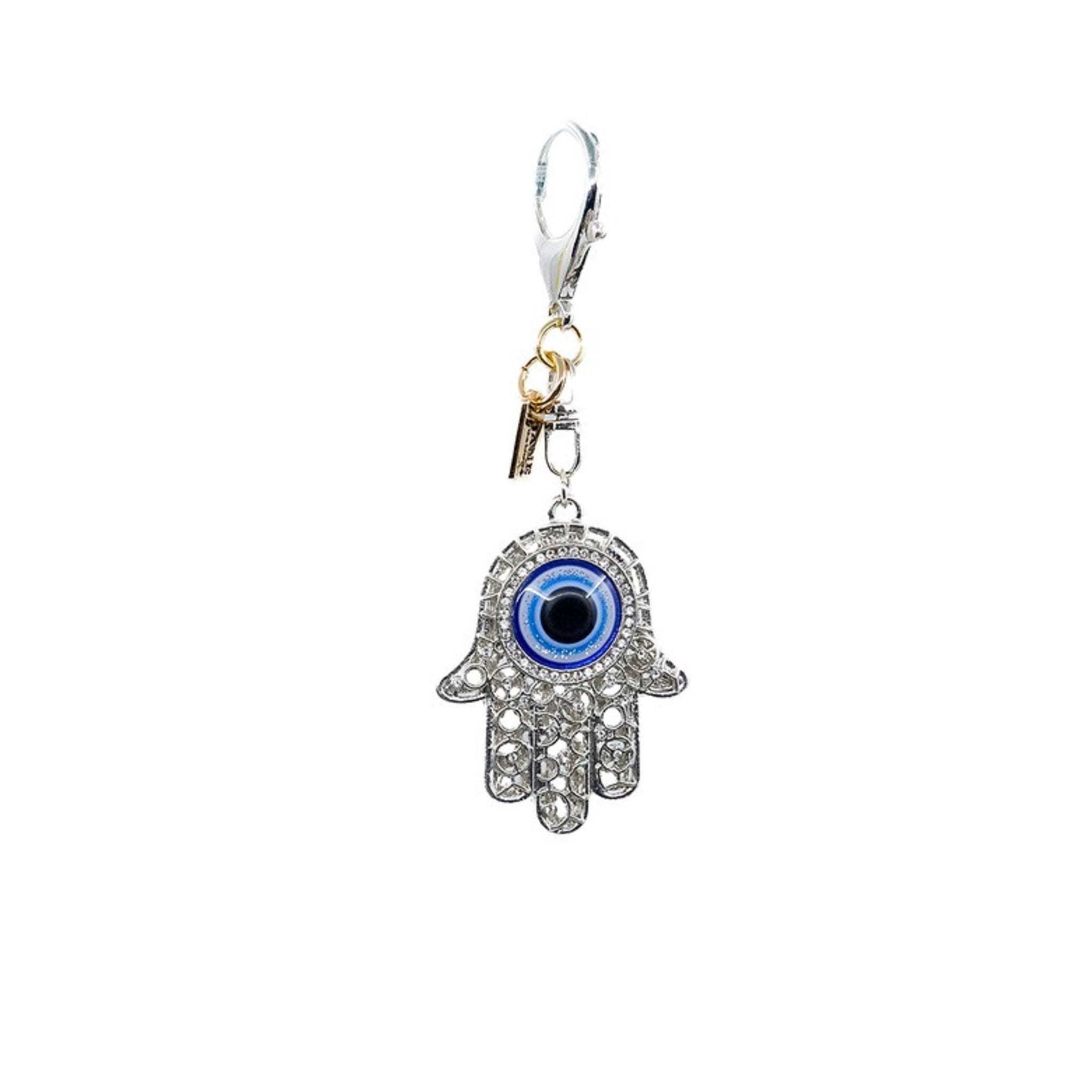 Embrace protection and positivity with this silver metal evil eye (Hamsa) charm. The intricate design and shimmering finish bring a meaningful touch to your accessories, symbolizing good fortune and spiritual well-being.