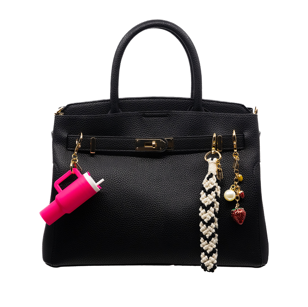 This delightful metal strawberry tassel charm brings a sweet and fruity flair to your collection. Its intricate design and vibrant colour add a whimsical touch to any accessory.  Bag Charm.  Purse Charm 