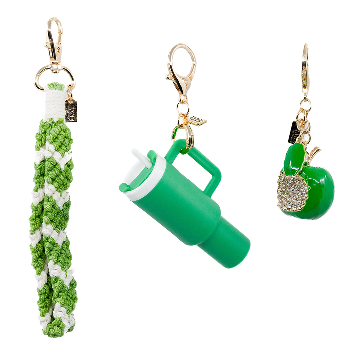 Green Stanley cup charm paired with a green metal apple and green/white macrame, creating a vibrant accessory set.  Purse Charm Bag Charm