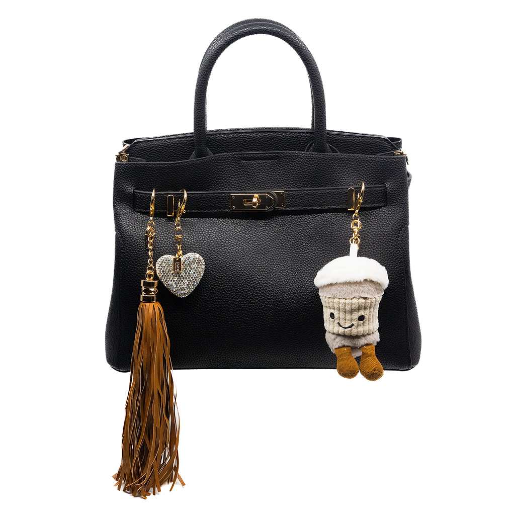 This shimmering heart charm adds a touch of elegance to your accessories. With its radiant sparkle, it effortlessly elevates your bag or purse, making it a delightful little addition that complements your vibes.