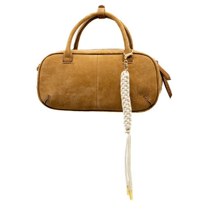 Our classic white braided tassel now with a gold clasp for easy attachment. Elegant, effortless, and perfect for layering with other charms for that “charm-core” aesthetic.