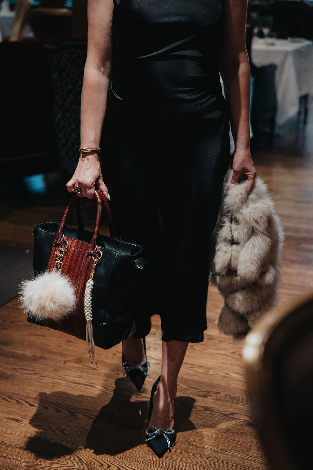 purse charms cords and poms on purse