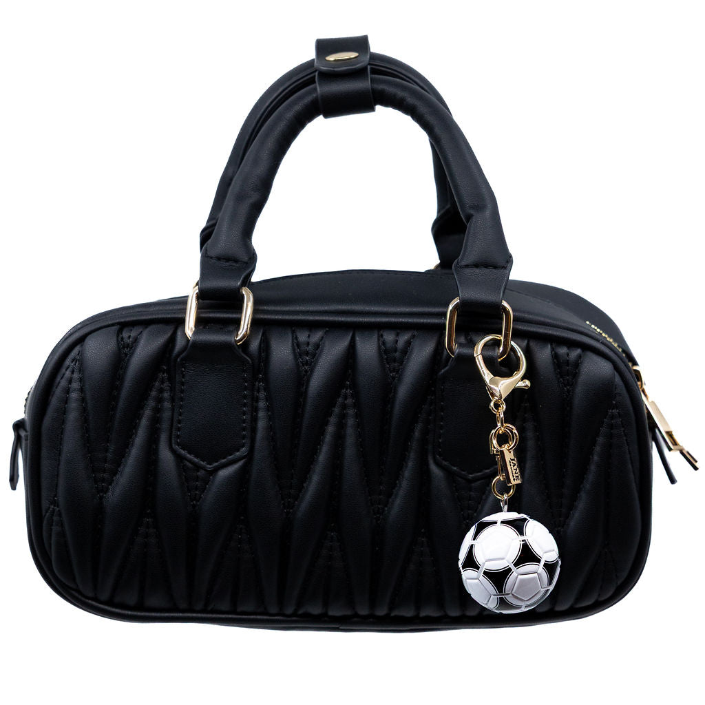Black handbag with a soccer ball charm