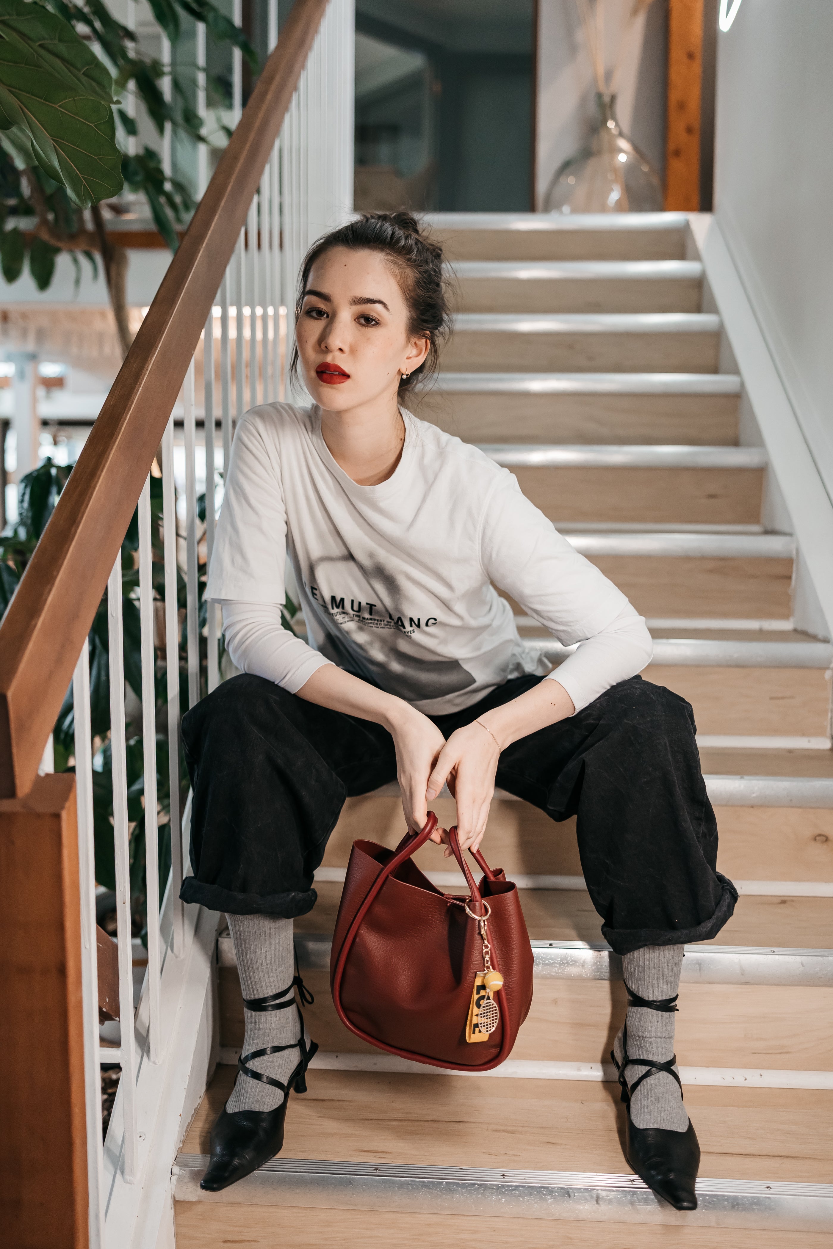 women with purse with tennis charm jane the brand