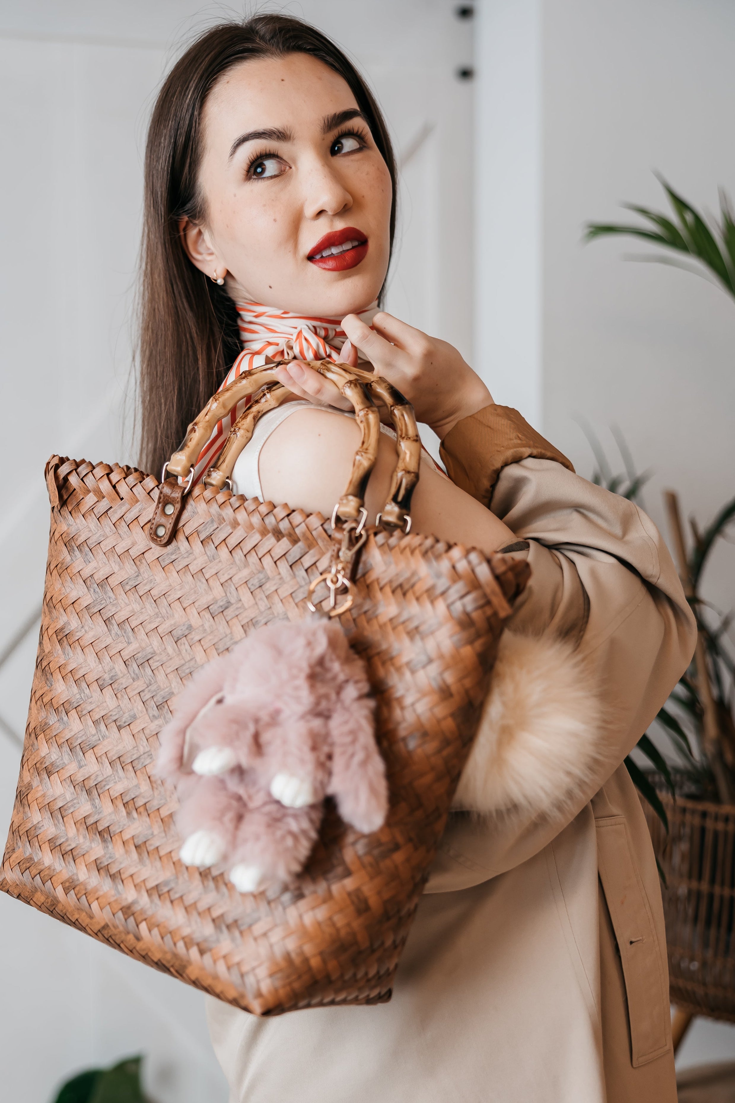 women holding a bag with charms, pink bunny charm fuzzy charm pom, march promo free charms